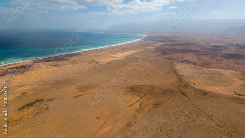 Aerial panorama of desert coastline and turquoise sea