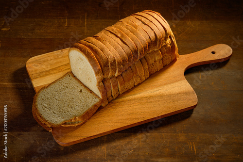 Whole wheat  bread on wooden background