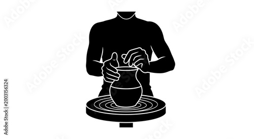 Person working on pottery wheel.