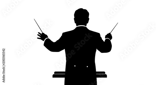 Silhouette of a male orchestra conductor.