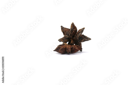 Принти на полотні Star anise on a white background is believed to relieve bloating and indigestion