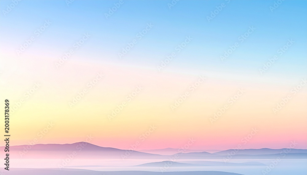 Fototapeta premium 淡い朝焼け空と霧に包まれた山並みの幻想的なパステル風景