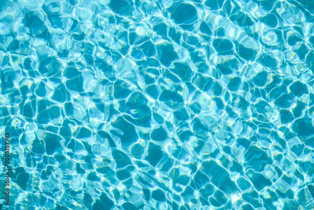 Fototapeta premium Reflections on the water in a clear pool.