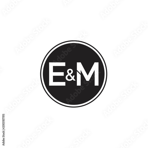 Circular emblem featuring the letters e and m with an ampersand symbol