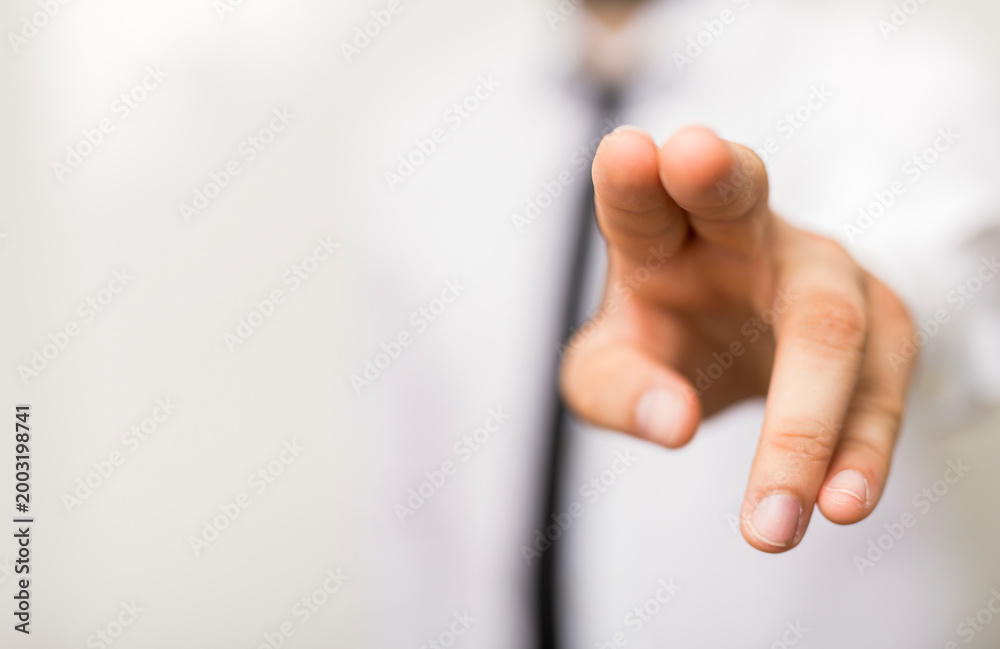 Obraz premium Close-up of hand pointing forward, offering a decision, choice or direction. Suitable for business,