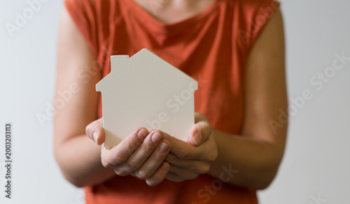 Person holding a small whit...
