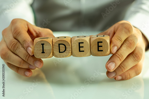 Hands hold wooden blocks wi...