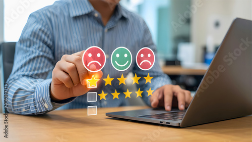 Customer feedback and rating system showing satisfaction levels with a person using a laptop and interacting with a rating scale