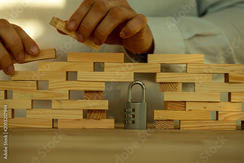 Hands building a wooden blo...