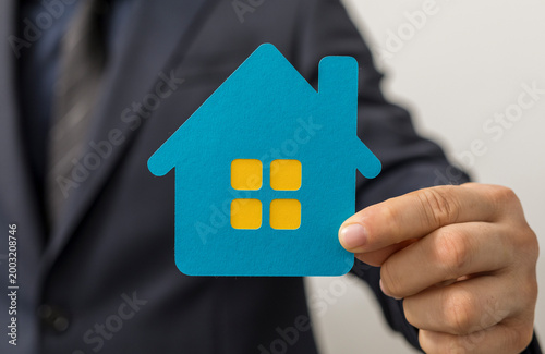 Person in a suit holding a ...