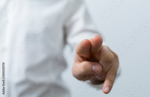 Close-up of a hand pointing...