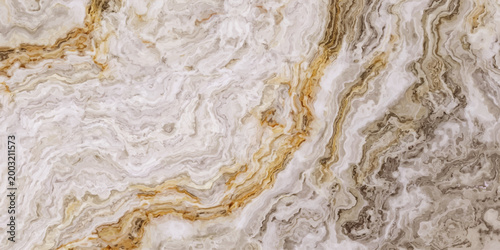 Macro closeup of a rough natural stone and sand surface showing a grunge abstract pattern with white marble and brown material textures