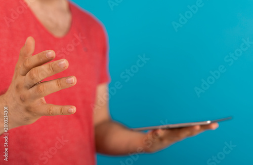 Person holding tablet, maki...