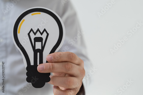 A hand holds a cutout light...