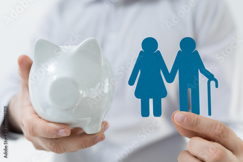 A piggy bank and elderly co...