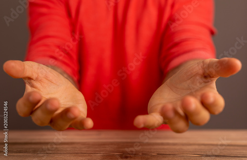 Person extending hands offe...