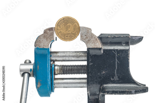 Photography 20 euro cent is clamped in a vice on white background