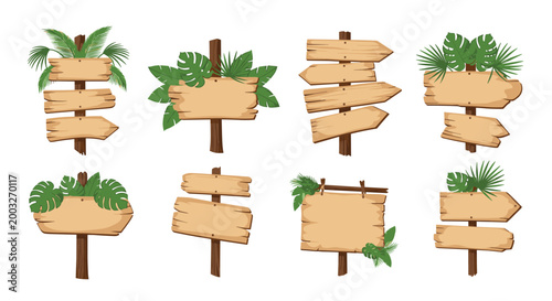 Set of eight different wooden signboards with tropical green leaves, ideal for direction markers or jungle-themed designs on a white background.