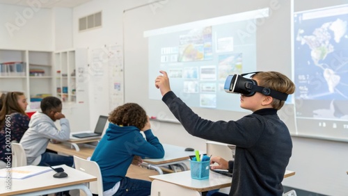 A classroom scene where a boy uses virtual reality goggles while other students work on laptops and listen attentively.