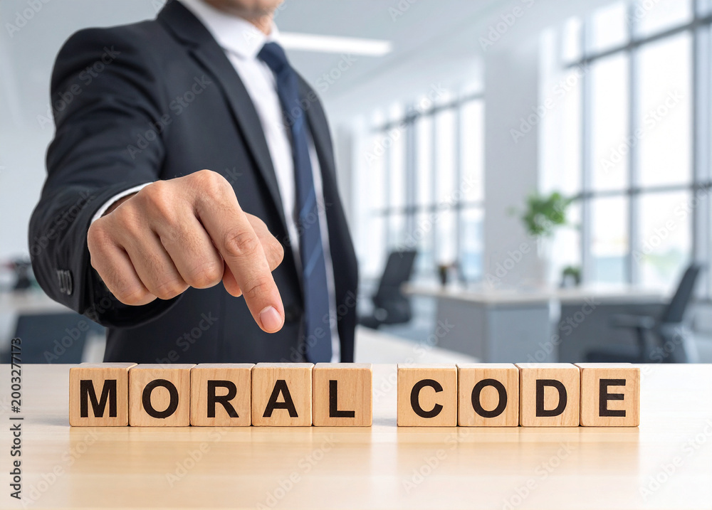Obraz premium Moral Code - Geschäftsmann zeigt auf den Text 