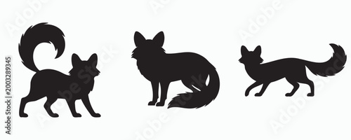 Black silhouettes of three foxes in different poses, isolated on light background. Minimalist animal illustration set showing standing and walking wild canines in side view.