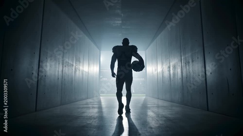 Silhouette of an American football player walking through a concrete tunnel toward bright stadium lights, athlete entering the arena for a professional sports competition