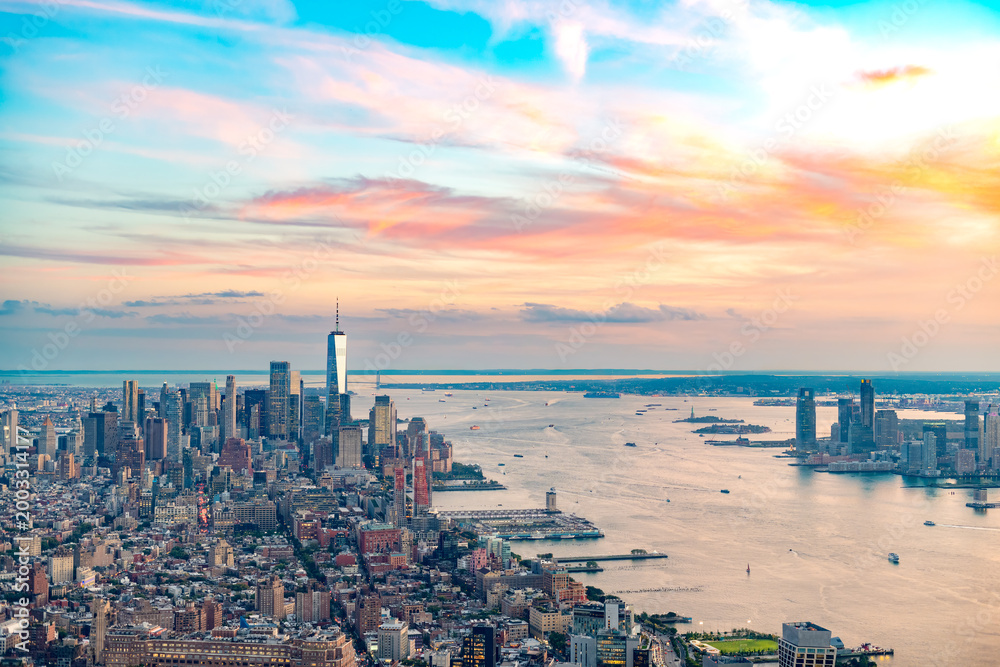 Fototapeta premium A high angle aerial panorama captures the densely packed financial district of downtown Manhattan, New York City, USA, with the expansive East River.