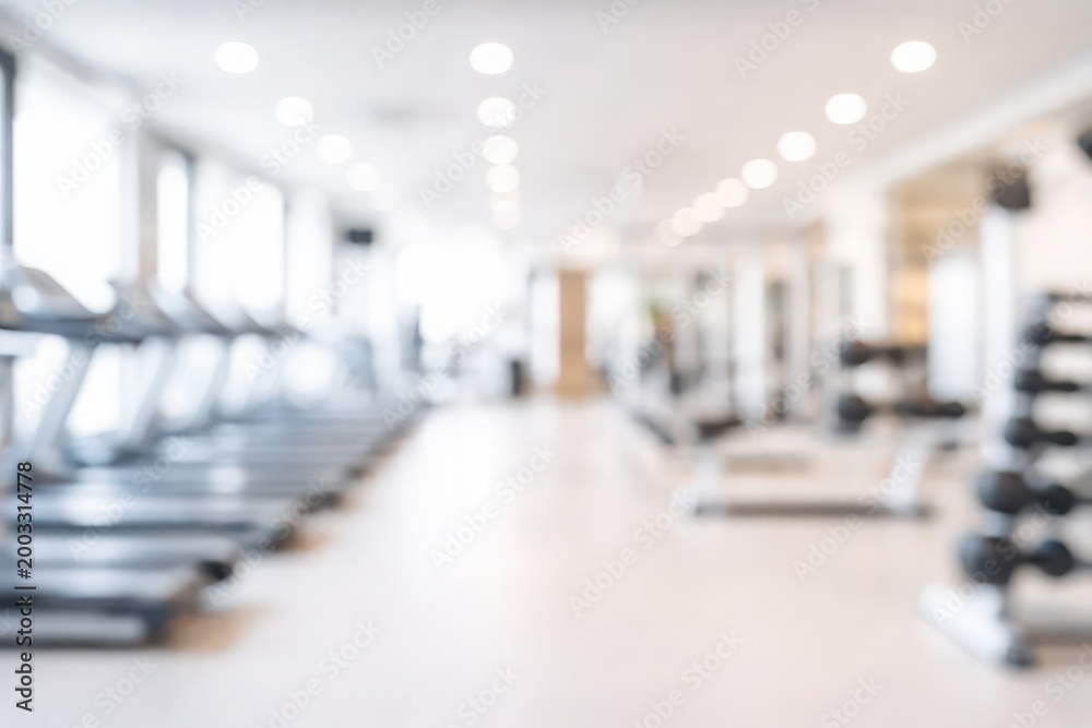 Fototapeta premium Modern gym interior with exercise equipment and bright lighting