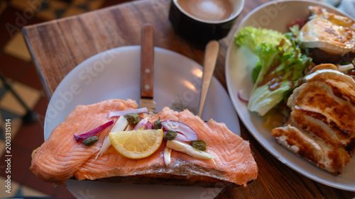 Tablou pe pânză the flat lay of table, with the tasty dish of smoked salmon sandwich that occupy
