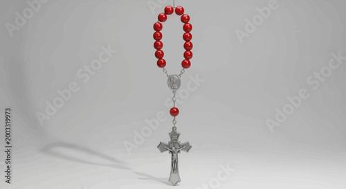 Red beads rosary with cross.