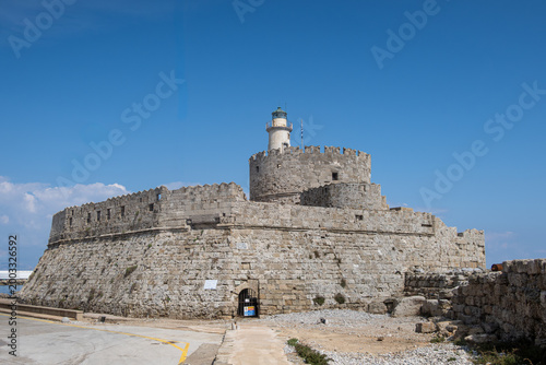 Lighthouse at 15th Century Fort of Saint Nicholas in Rhodes, Greece.