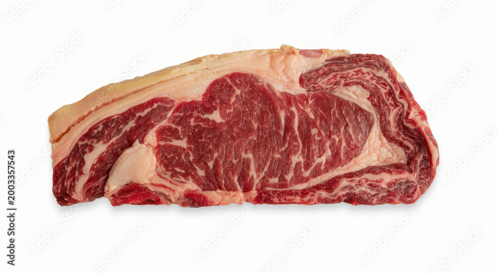 Fototapeta premium Raw fresh ribeye beef steak cut with visible marbling and fat layer isolated on white background