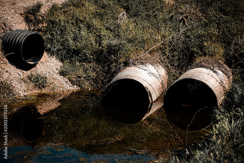 Tableau sur toile Flood flow fills drainage ditch fast