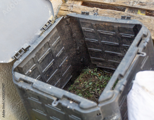 plastic composter bin in garden