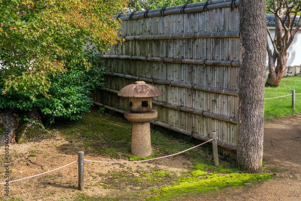Naklejka premium Stone Lantern (ishi-dore) in the Koko-en Garden on a sunny autumn day, Himeji, Hyogo Prefecture, Japan