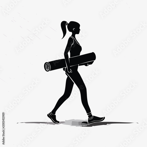 Silhouette of a woman walking with a yoga mat silhouette exercise activity