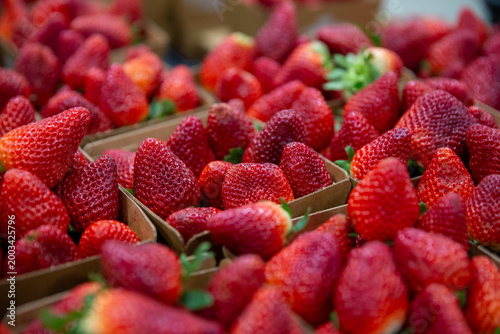 Bunches of Strawberries in cardboard baskets