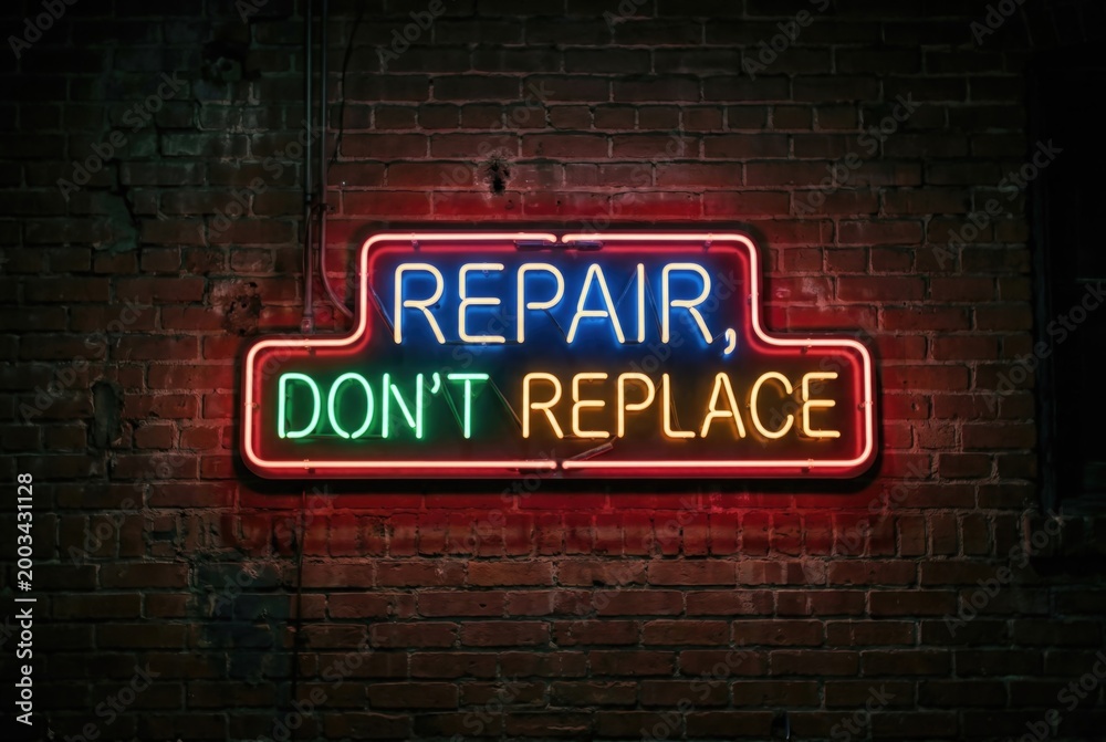 Obraz premium Repair Dont Replace glowing neon text sign illuminated on a brick wall