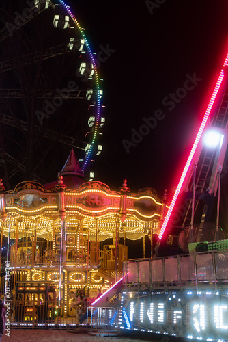 Night carnival atmosphere with neon lights toys and attractions in Prague Czech Republic Europe entertainment background