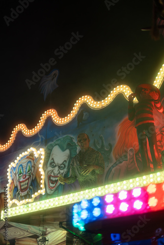 Haunted house at night in amusement park Prague Czech Republic Europe glowing horror attraction background