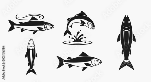 Foto Set of various fish silhouettes in different poses including jumping and swimming isolated on a white background