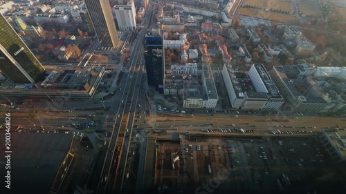 Panoramic aerial view of city skyline with tall buildings and sunset light