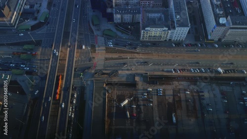 Aerial top down view of busy city street intersection and urban infrastructure