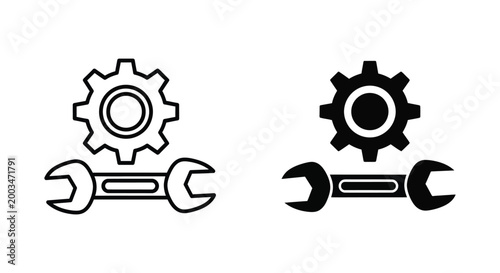 Wrench and gear icons one outlined and one solid black representing mechanics or industry