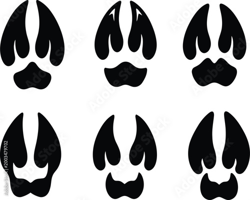 Animal paw prints silhouette a collection of six dark footprints