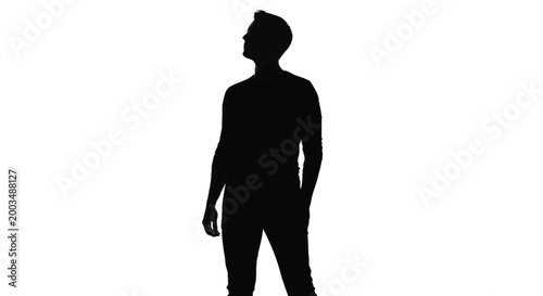 Full body silhouette of a man standing tall and looking upwards with deep thought