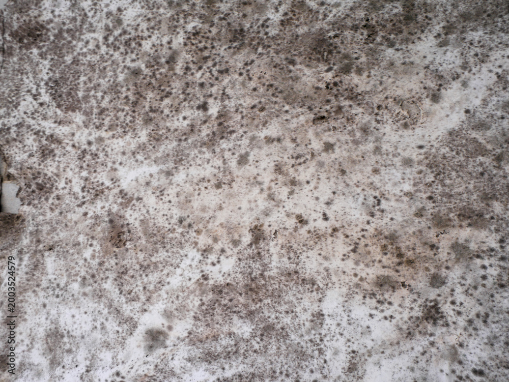 Fototapeta premium Grunge texture of some dark spots on a white fabric surface
