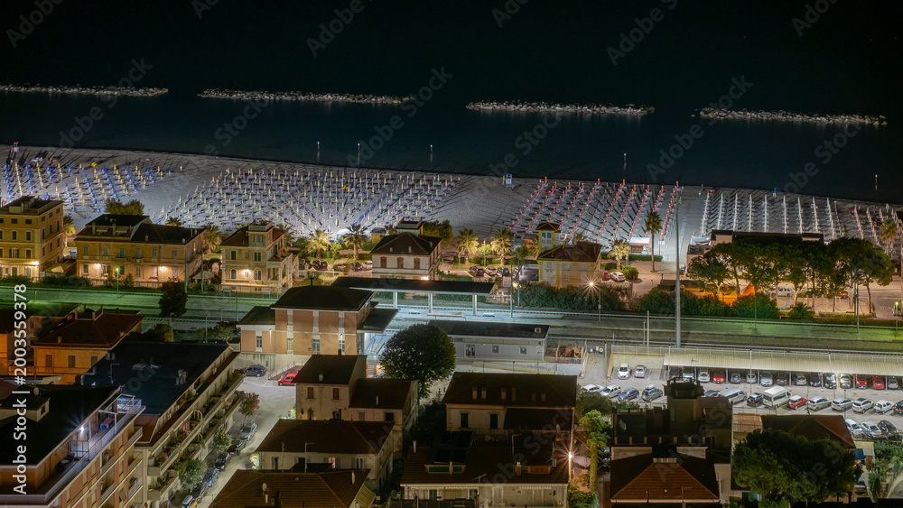 Fototapeta premium Night vision of Cupra Marittima and its beach. Acoli Piceno, Marche, Italy