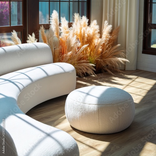 Cozy Corner With a Soft Pouf and Tall Plants in a Bright Room With Large Wind...