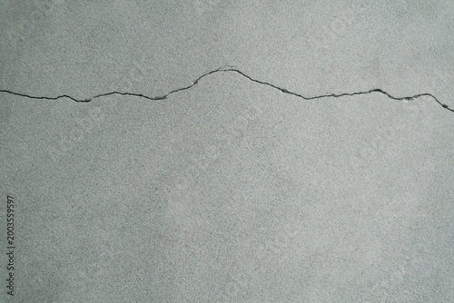 horizontal crack in a concrete wall. horizontal cracks are generally considered more serious than vertical ones, as they often signal that the wall is under excessive lateral (sideways) pressure 